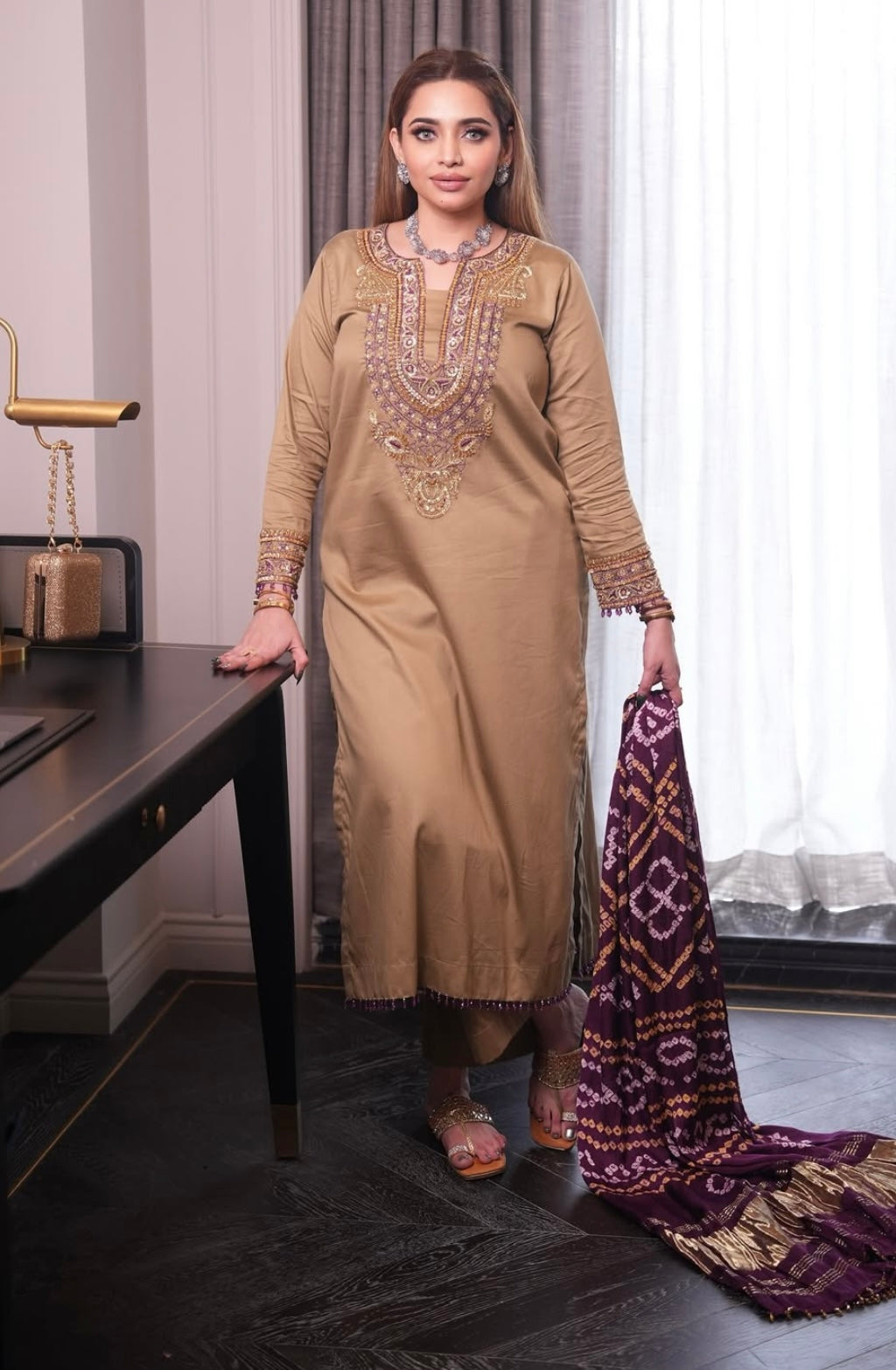 Elegant dress features a traditional Badhani dupatta