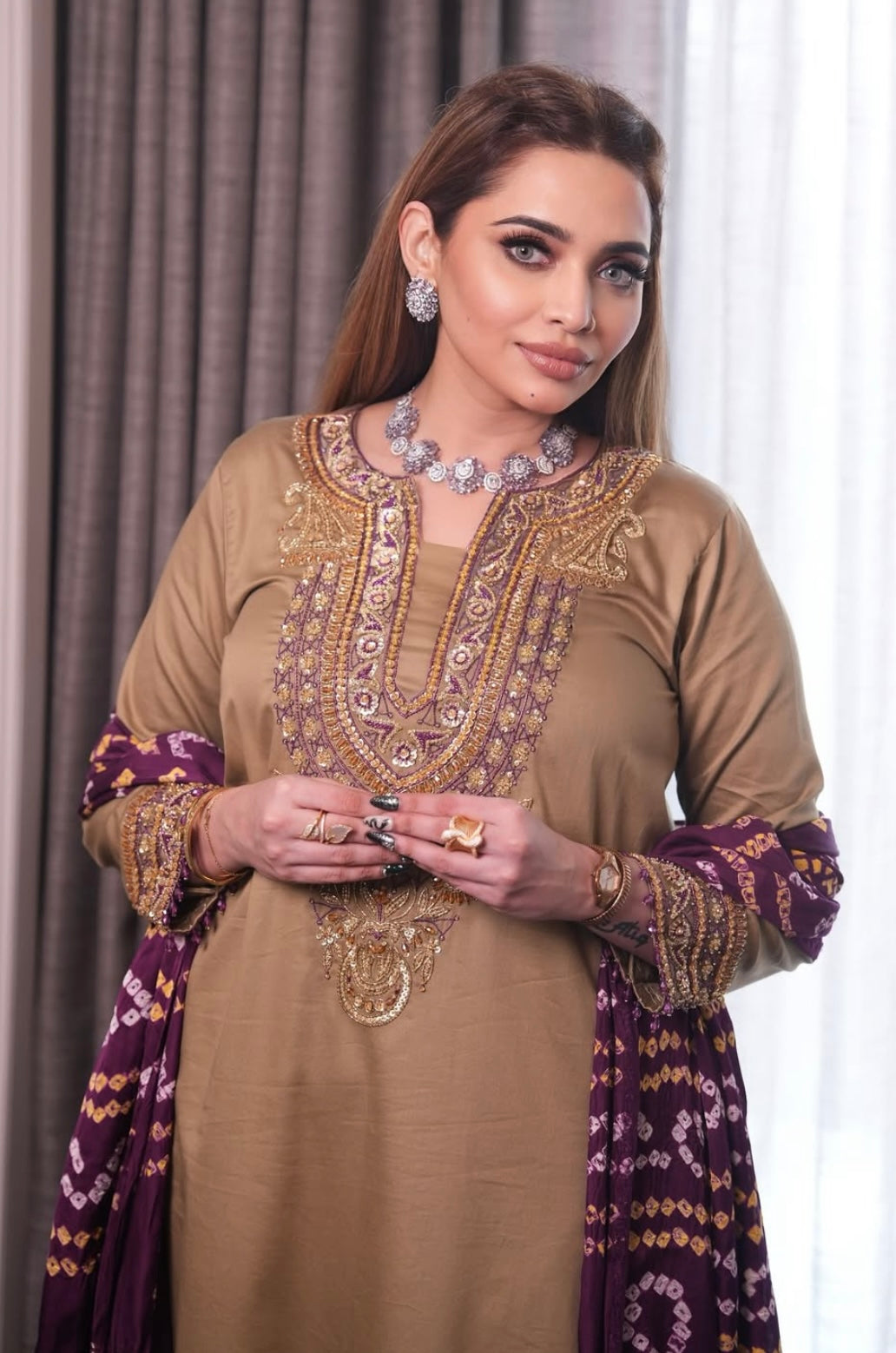 Elegant dress features a traditional Badhani dupatta