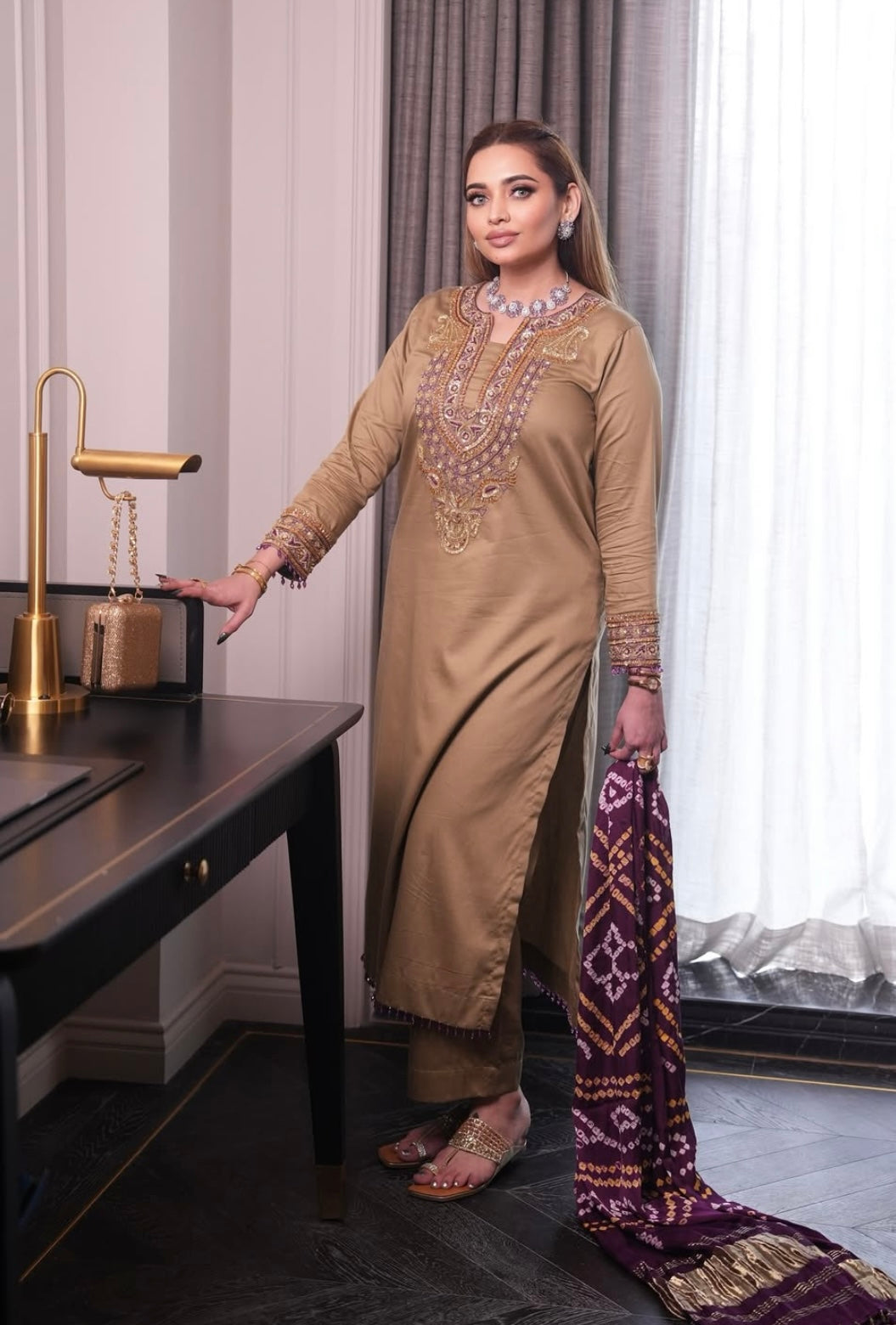 Elegant dress features a traditional Badhani dupatta