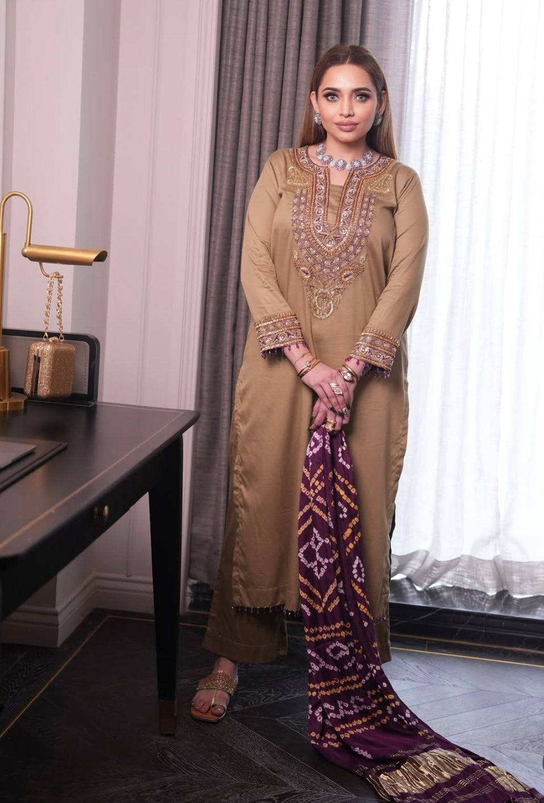 Elegant dress features a traditional Badhani dupatta