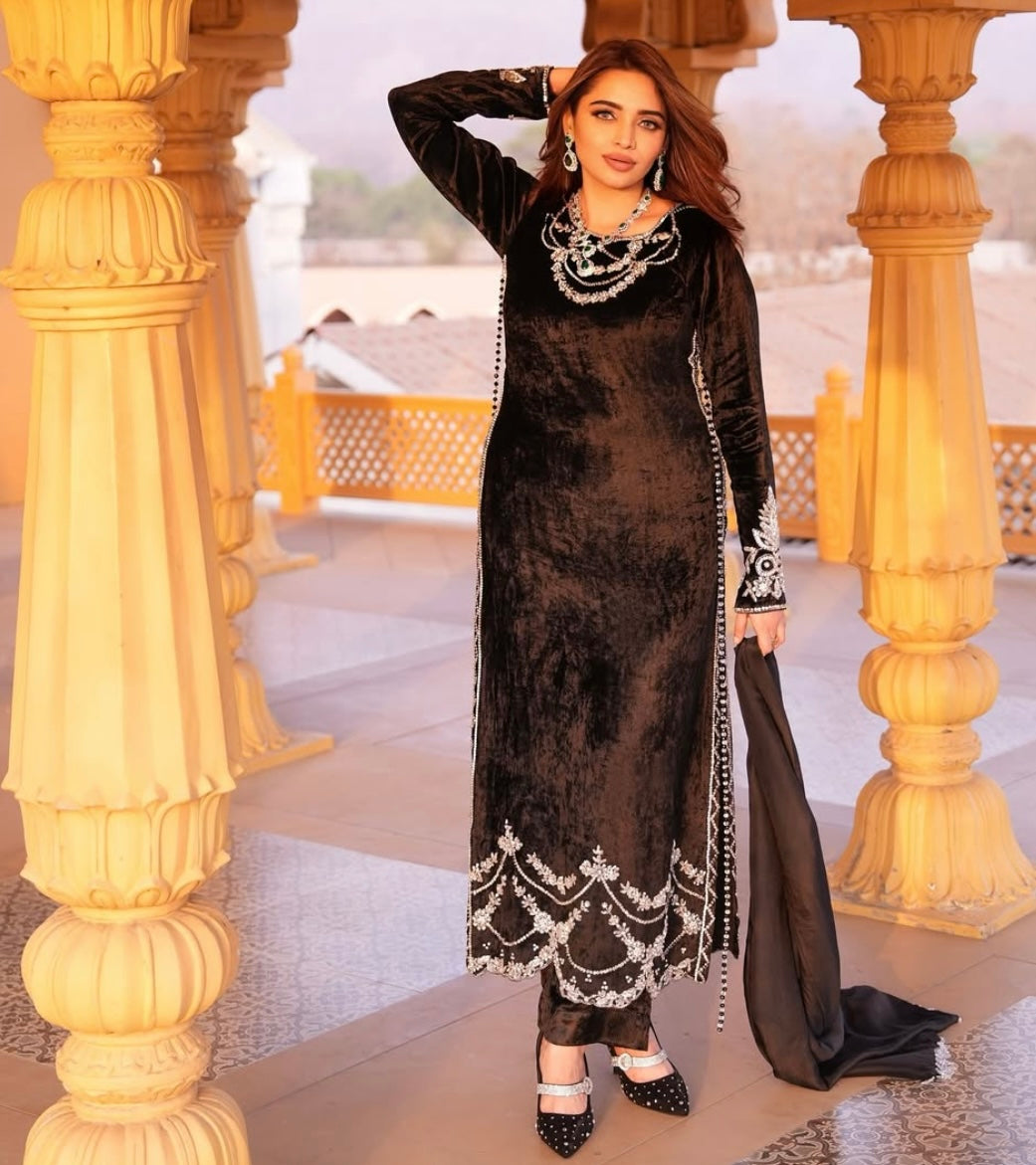 This black velvet dress combines timeless elegance with luxurious texture