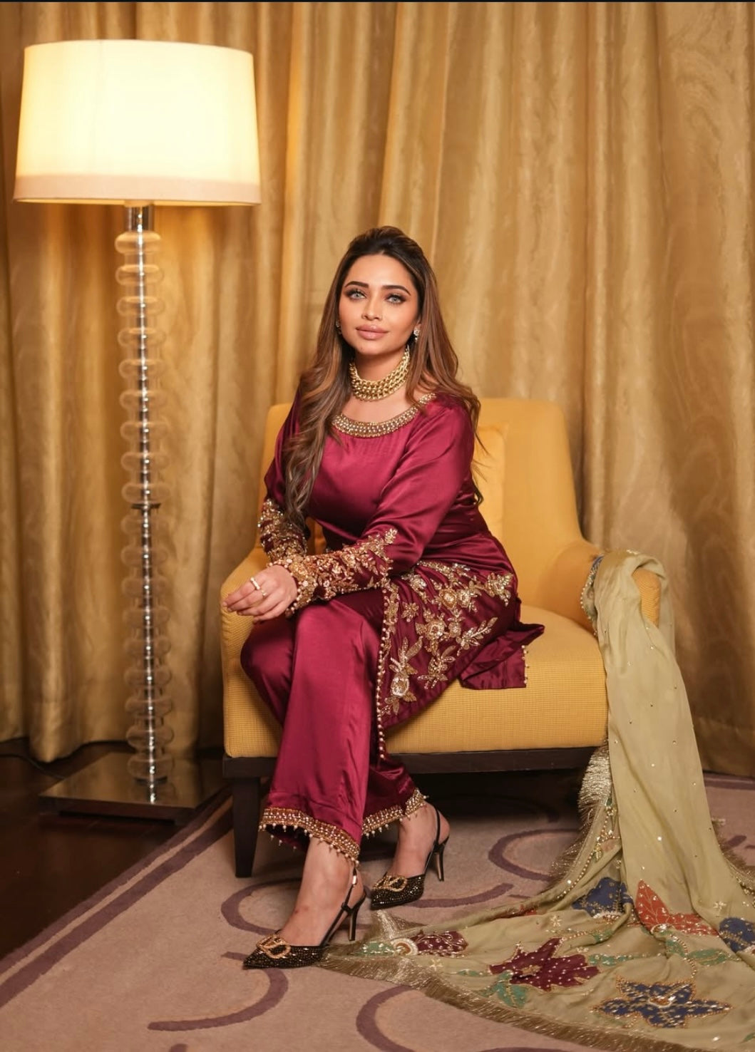 This elegant red dress paired with a richly embroidered Pakistani dupatta