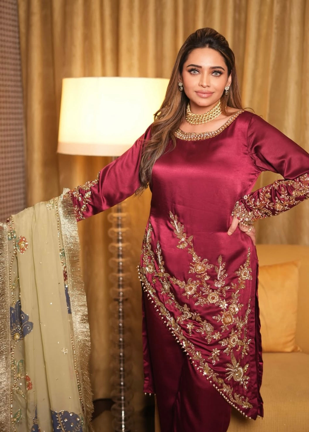 This elegant red dress paired with a richly embroidered Pakistani dupatta