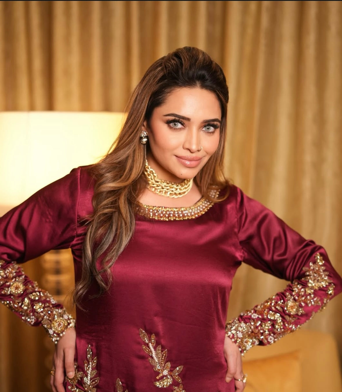This elegant red dress paired with a richly embroidered Pakistani dupatta
