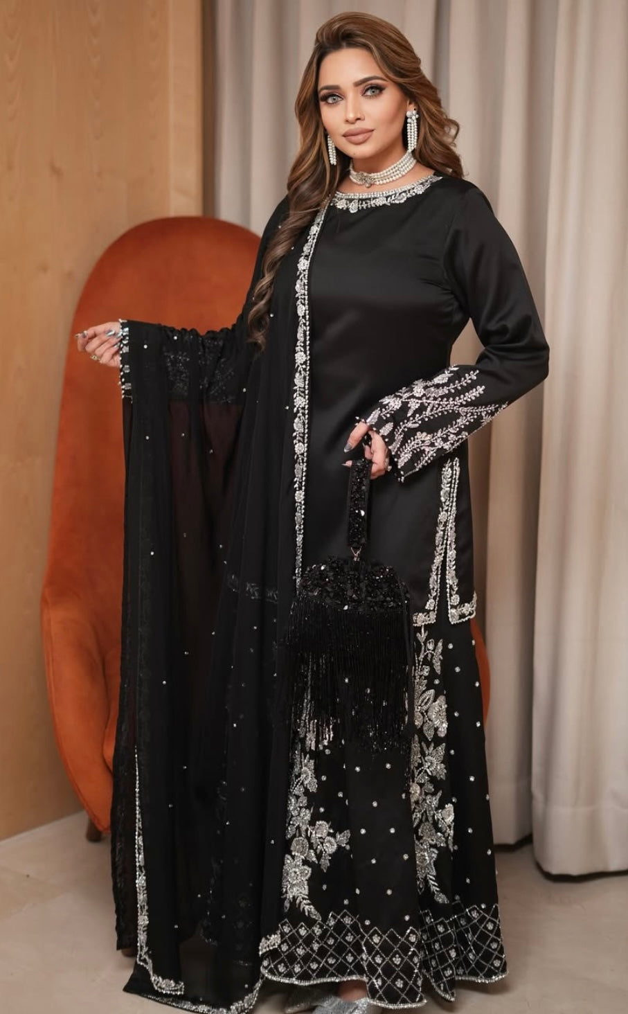 Black heavy dress paired with an elephant plazo