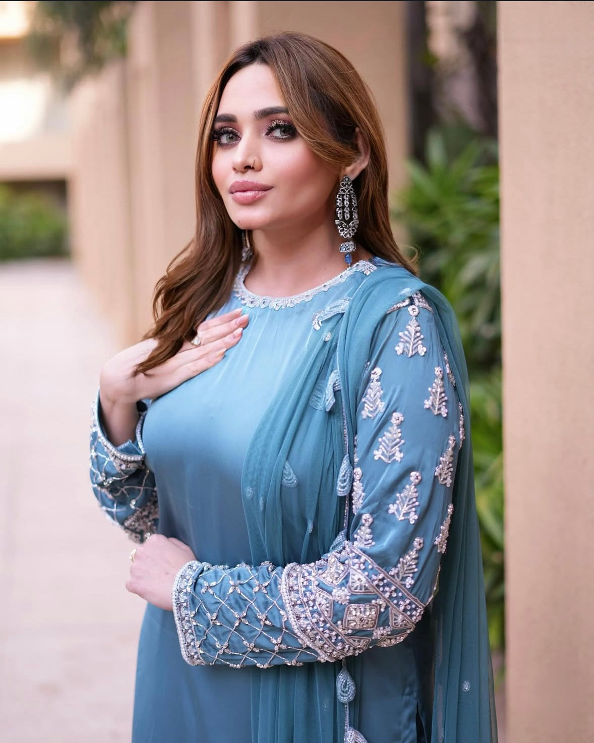 Long kamiz paired with a richly textured heavy dupatta