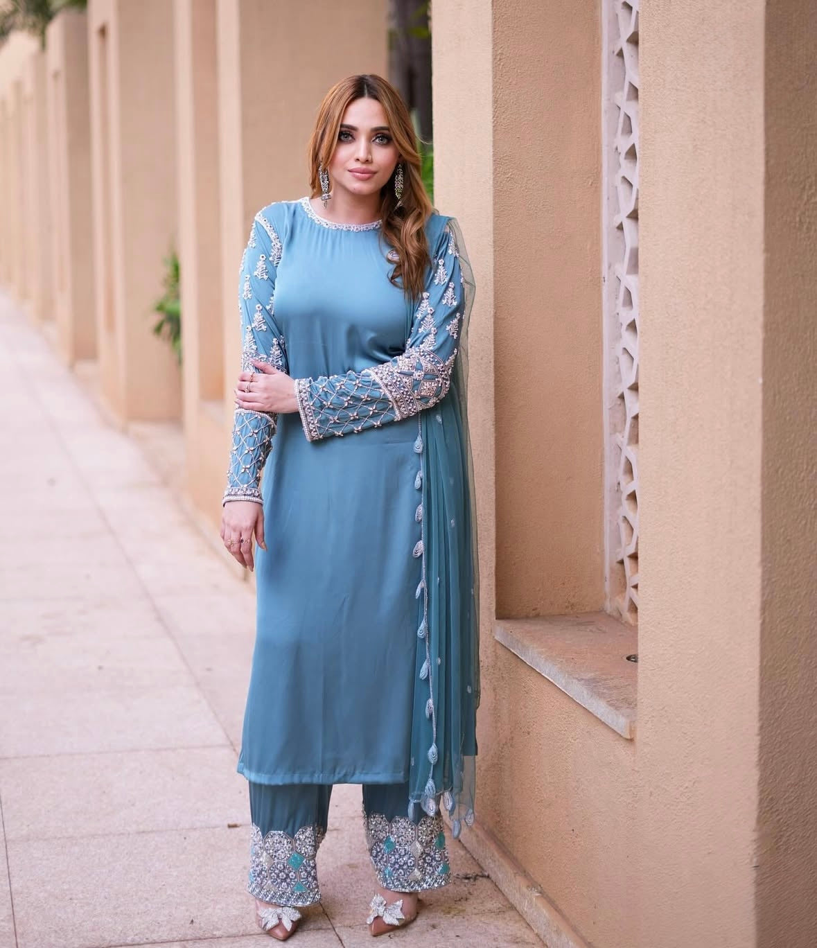 Long kamiz paired with a richly textured heavy dupatta