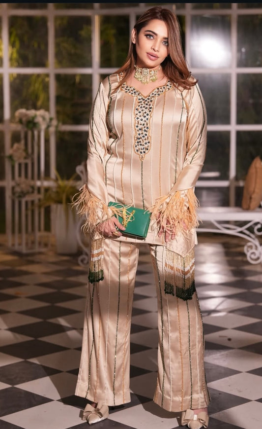 Shiny Gold dress features luxurious fur accents