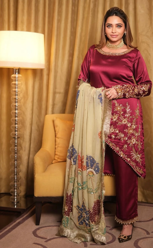 This elegant red dress paired with a richly embroidered Pakistani dupatta