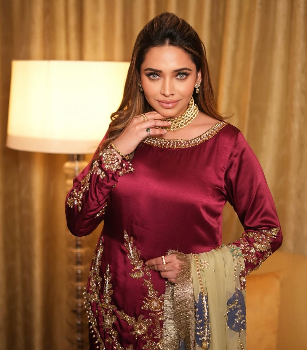 This elegant red dress paired with a richly embroidered Pakistani dupatta