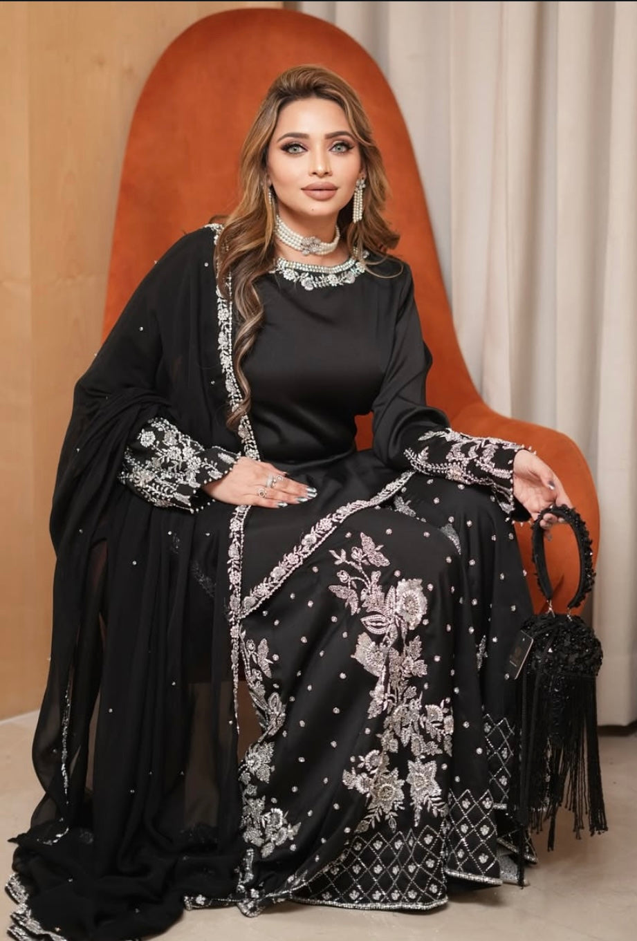 Black heavy dress paired with an elephant plazo