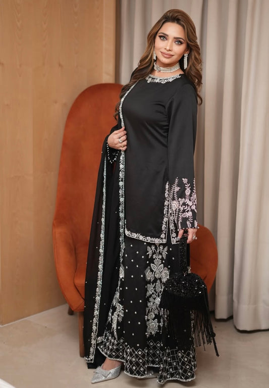 Black heavy dress paired with an elephant plazo