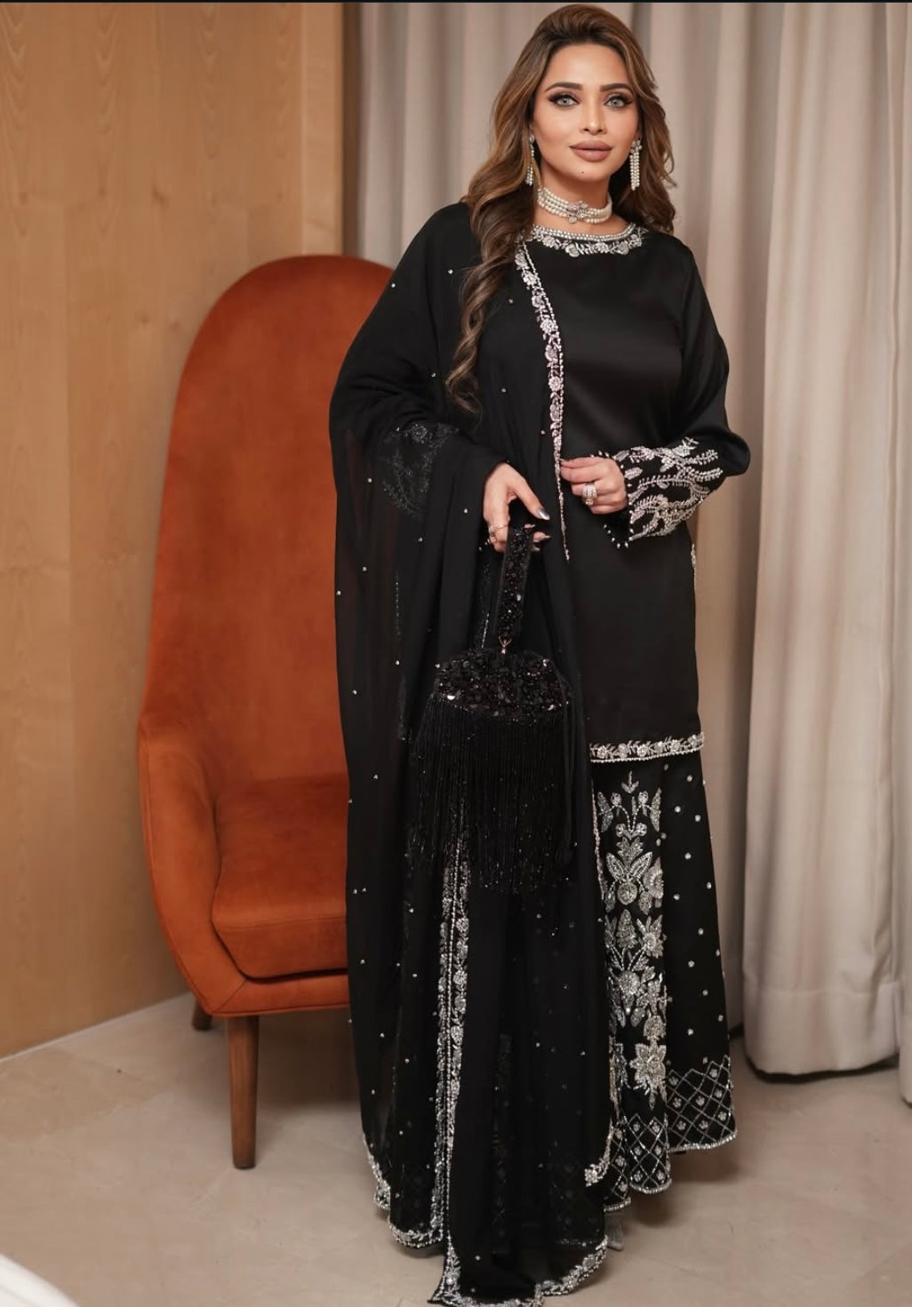 Black heavy dress paired with an elephant plazo