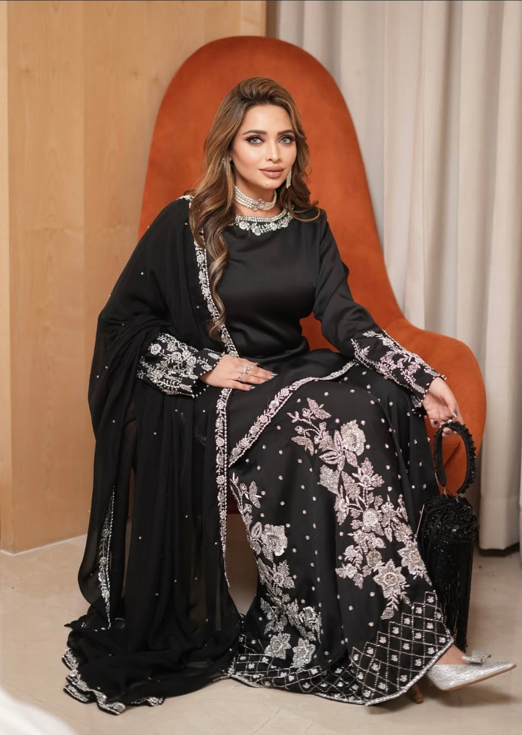 Black heavy dress paired with an elephant plazo