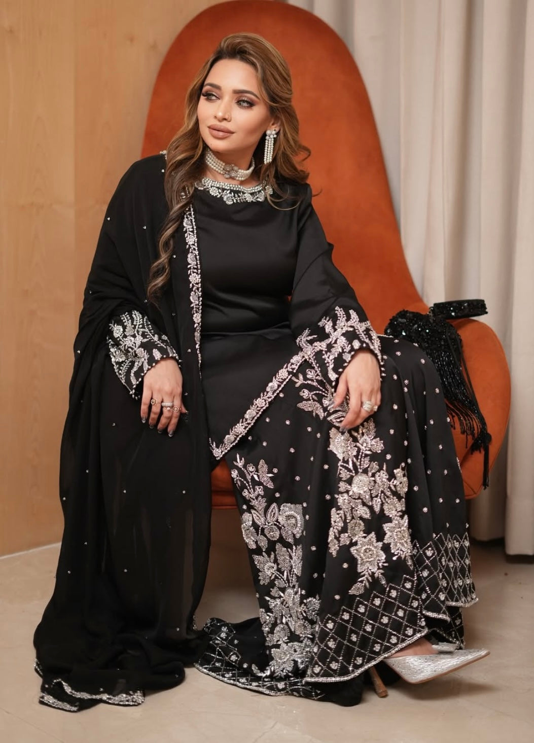 Black heavy dress paired with an elephant plazo