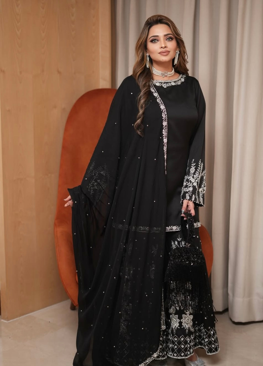Black heavy dress paired with an elephant plazo