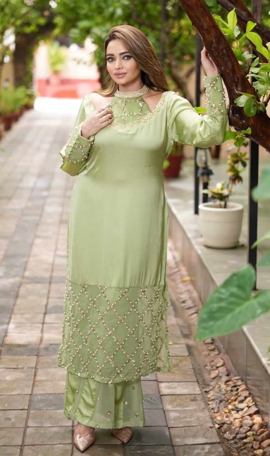 Green Dress features a stylish shoulder cut design