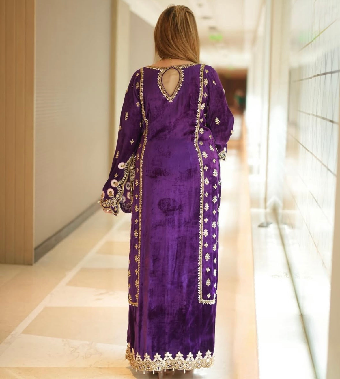 Luxurious velvet purple dress features intricate heavy work