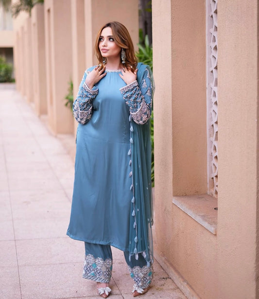 Long kamiz paired with a richly textured heavy dupatta