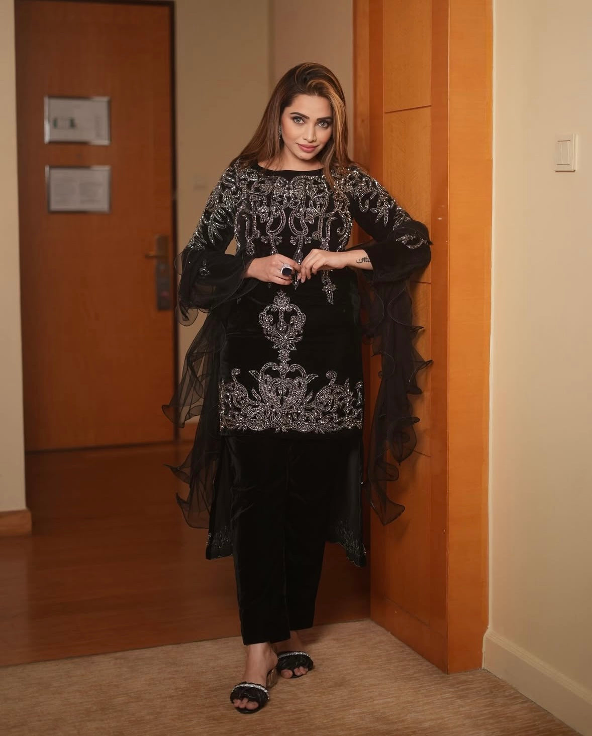 Velvet dress features intricate silver embroidery