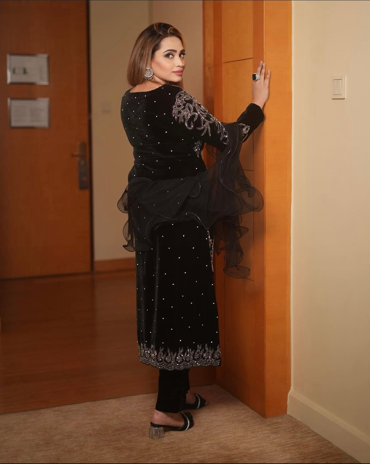 Velvet dress features intricate silver embroidery